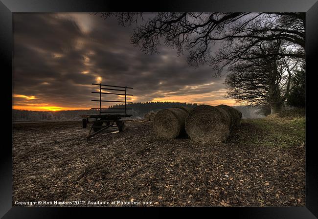 Trailer & the bales at dusk Framed Print by Rob Hawkins