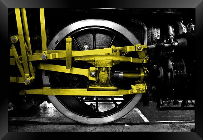 Yellow wheel of steel Framed Print by Rob Hawkins