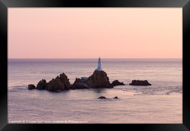 La Corbière lighthouse at sunset, Jersey. Framed Print by Douglas Kerr