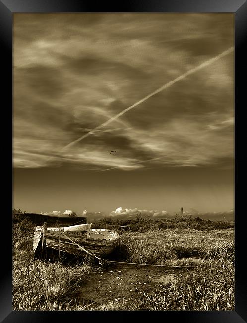 Stranded rowing boat at Low tide Sepia Framed Print by Paul Macro