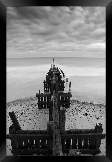 Stormy Groynes Framed Print by Paul Macro