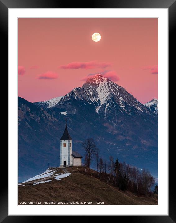 Full moon rising over Jamnik church and Storzic at sunset Framed Mounted Print by Ian Middleton