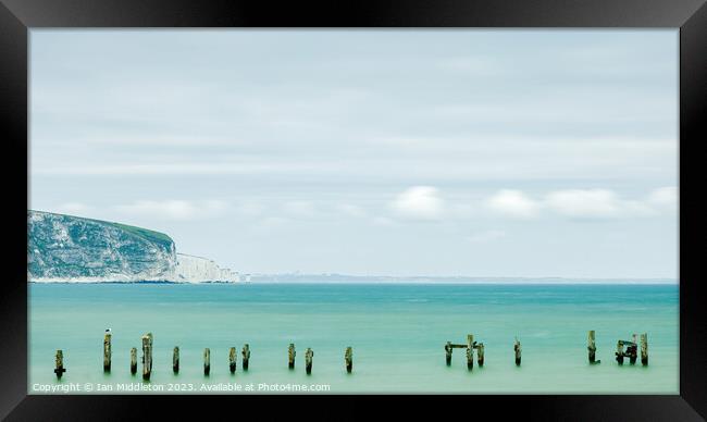 Swanage Old Pier with Old Harry in the distance Framed Print by Ian Middleton
