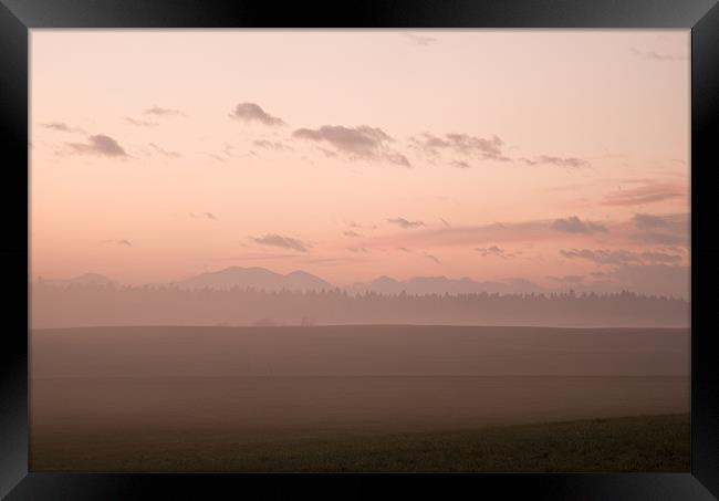 Misty fields at sunset Framed Print by Ian Middleton