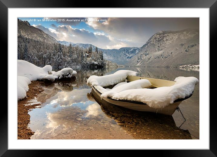 Snow covered boat on Lake Bohinj in Winter Framed Mounted Print by Ian Middleton