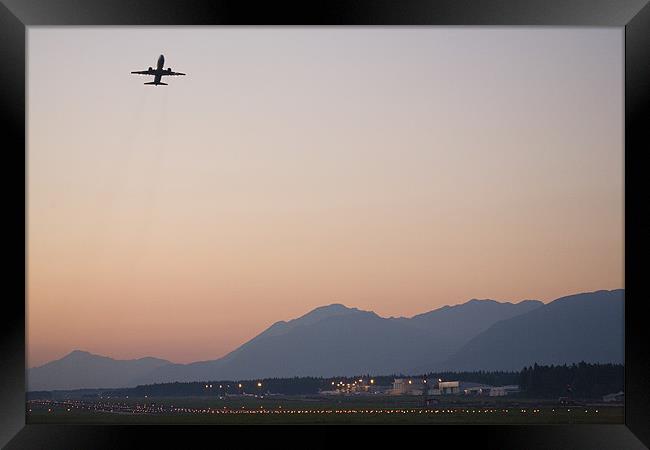 Aircraft taking off at dusk Framed Print by Ian Middleton