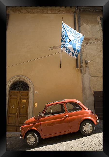 Old Fiat parked in steep street on a hill in Italy Framed Print by Ian Middleton