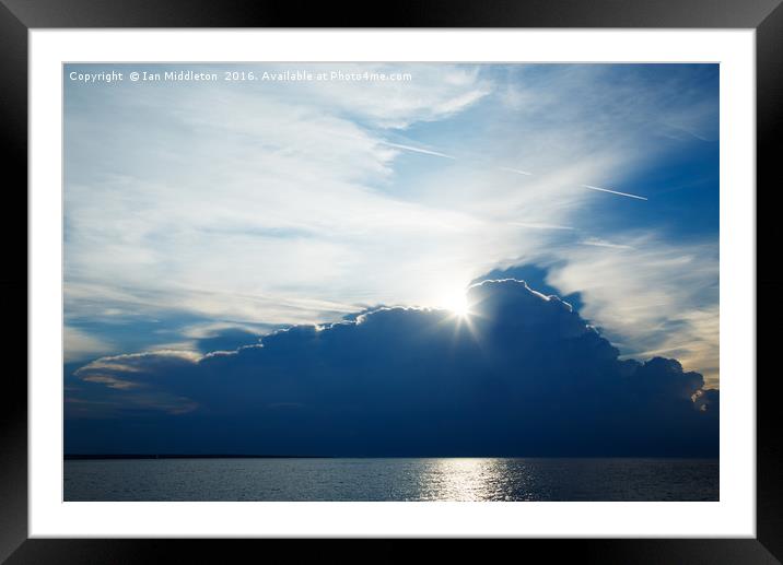 Storm clouds moving away in the morning Framed Mounted Print by Ian Middleton