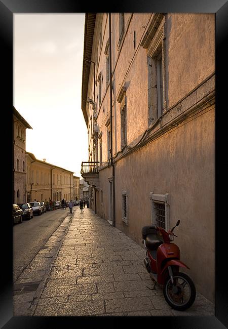 Moped in street at sundown in Assisi, Italy Framed Print by Ian Middleton
