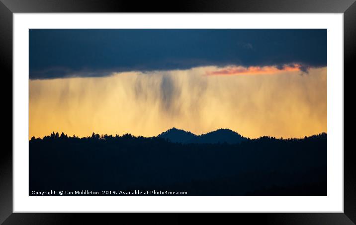 Rain at sunset over the Ljubljana hills Framed Mounted Print by Ian Middleton