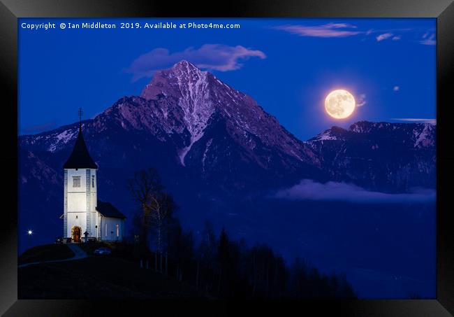 Full moon rising over Jamnik church and Storzic at Framed Print by Ian Middleton