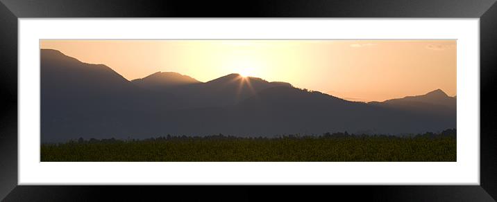 Sunrise bursting over the kamnik alps and rapeseed Framed Mounted Print by Ian Middleton