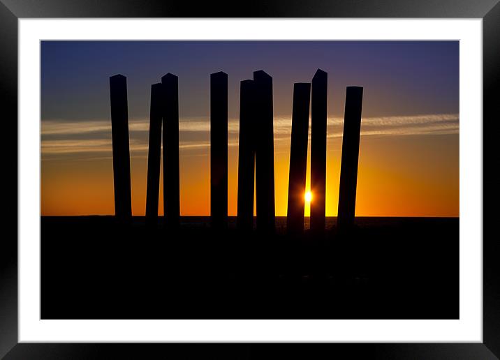 Sunrise through a sculpture. Framed Mounted Print by David Hare