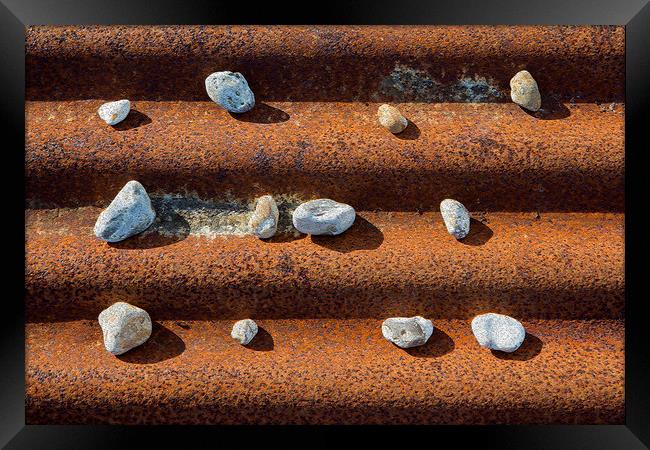 Pebbles on Rust Framed Print by David Hare