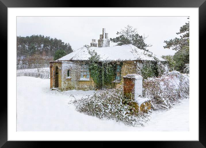 Snow covered abandoned cottage Framed Mounted Print by David Hare