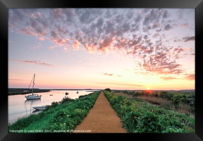 Boats and footpath at sunrise. Burnham Overy Staithe, Norfolk, U Framed Print by Liam Grant