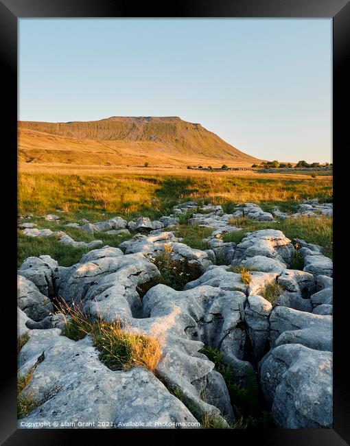 UK, Yorkshire, Ingleborough with limestone pavement in the foreground. Framed Print by Liam Grant