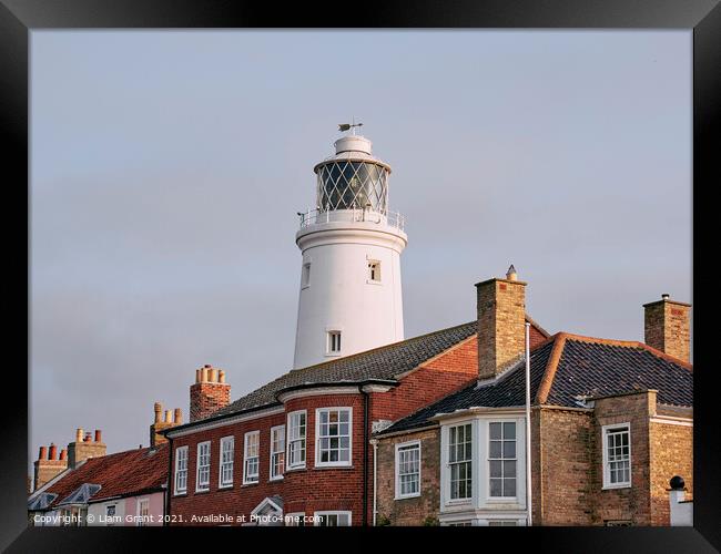 UK, Suffolk, Light from the sunrise on southwold lighthouse Framed Print by Liam Grant