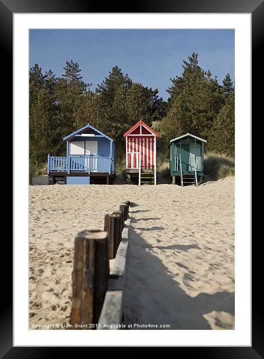 Beach huts and blue sky. Wells-next-the-sea. Framed Mounted Print by Liam Grant