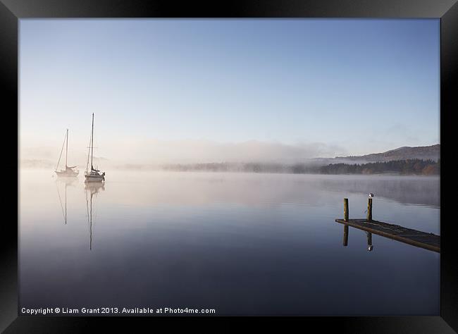 Morning mist and boats on Lake Windermere. Framed Print by Liam Grant