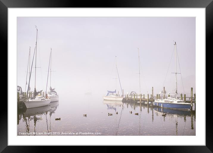 Boats in fog on Lake Windermere. Framed Mounted Print by Liam Grant