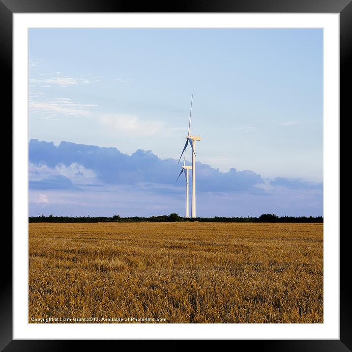 Evening sky and rural Wind turbines. Framed Mounted Print by Liam Grant