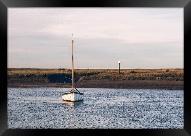 Boat and marshes. Burnham Overy Staithe. Framed Print by Liam Grant