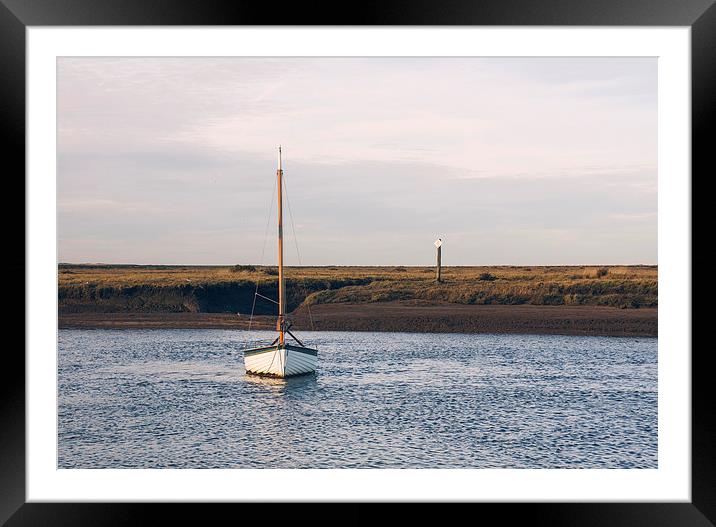 Boat and marshes. Burnham Overy Staithe. Framed Mounted Print by Liam Grant
