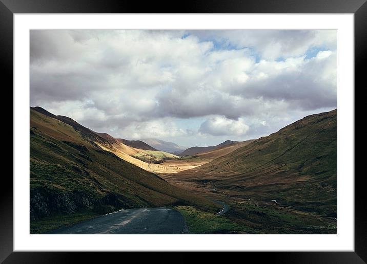 Sunlight in the valley near Newland Hause. Keskada Framed Mounted Print by Liam Grant