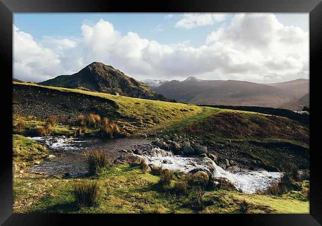 Cinderdale Beck flowing below Whiteless Pike towar Framed Print by Liam Grant