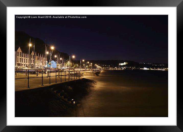 Oystermouth Castle and Mumbles seafront at night.  Framed Mounted Print by Liam Grant