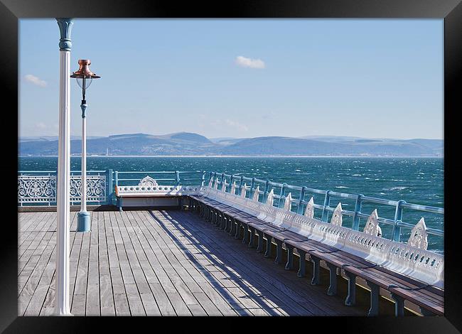 Lamp and seating on Mumbles Pier. Wales, UK. Framed Print by Liam Grant