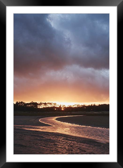 Storm clouds at sunset. Holkham, Norfolk, UK. Framed Mounted Print by Liam Grant