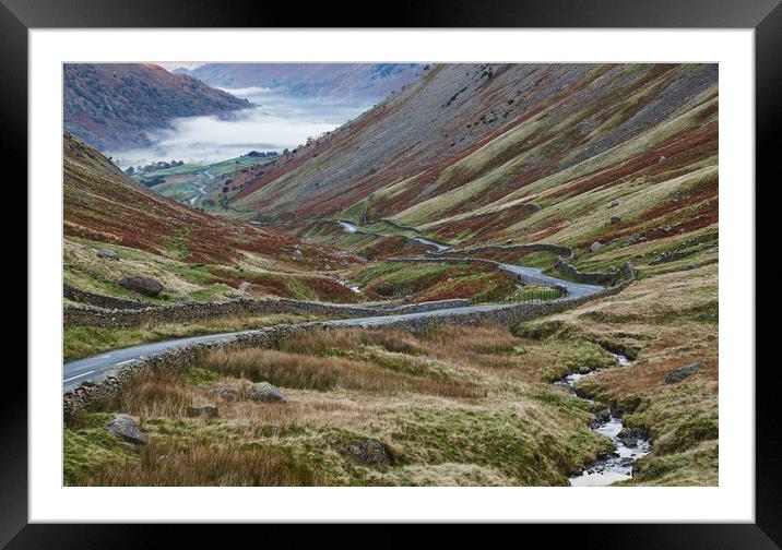 Fog formed in the valley at sunrise. Kirkstone Pas Framed Mounted Print by Liam Grant