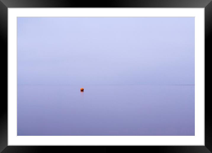 Cloudy sky a bouy reflected in a calm ocean at twi Framed Mounted Print by Liam Grant