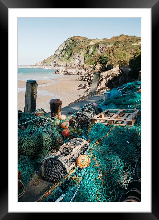 Fishing nets and lobster pots in the harbour at Il Framed Mounted Print by Liam Grant