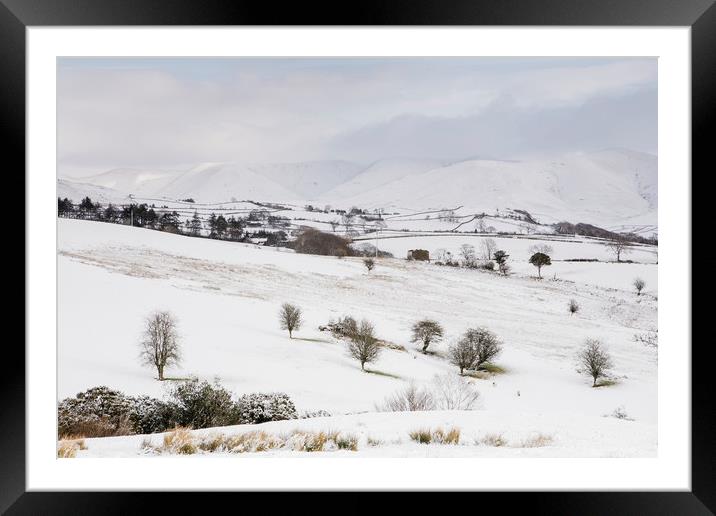 Snow covered mountains and farmland. Cumbria, UK. Framed Mounted Print by Liam Grant