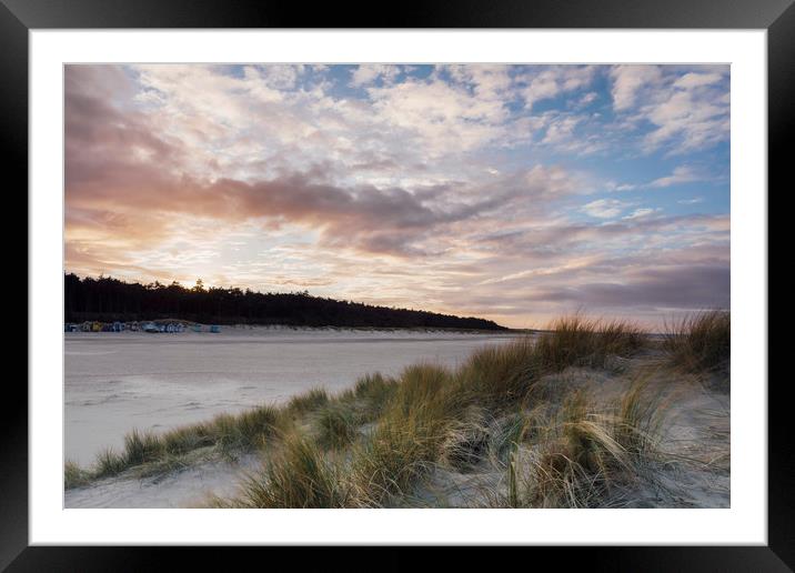 Sunset and beach huts. Wells-next-the-sea, Norfolk Framed Mounted Print by Liam Grant
