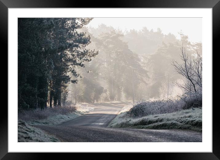 Rays of sunlight and frost along a remote country  Framed Mounted Print by Liam Grant