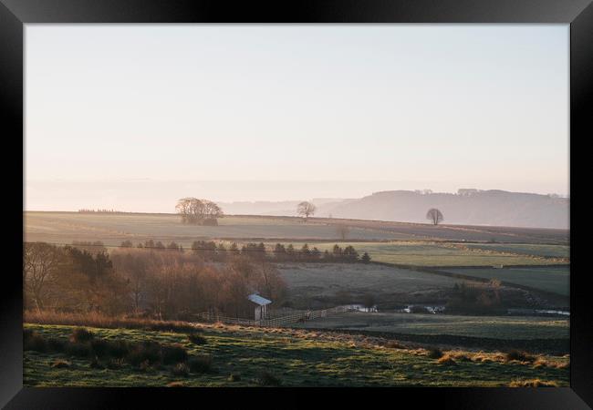 Early morning light at sunrise over a farm in Derb Framed Print by Liam Grant
