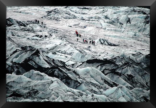 Climbing the glacier Framed Print by Howard Corlett