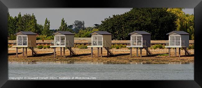 Osea Beach Huts Framed Print by Howard Corlett