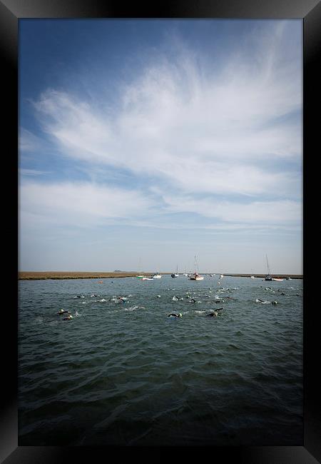 Norfolk Swimmers Framed Print by Simon Wrigglesworth