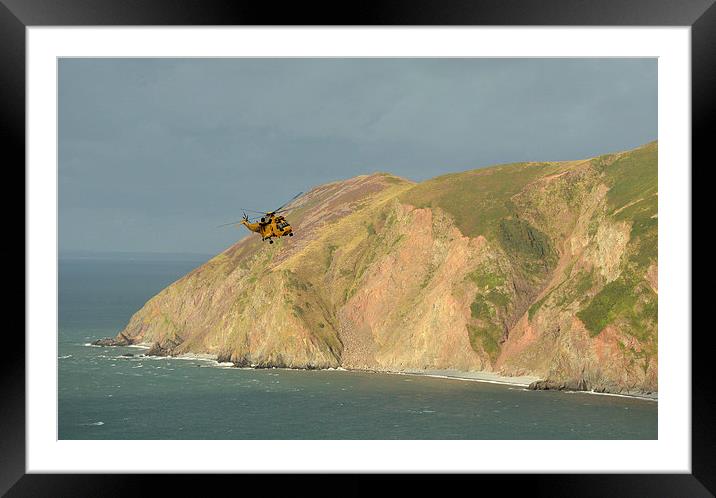 Rescue Helicopter over Lynmouth Bay  Framed Mounted Print by graham young