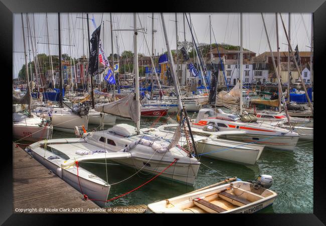 Majestic Yachts Soaring in Weymouth Framed Print by Nicola Clark