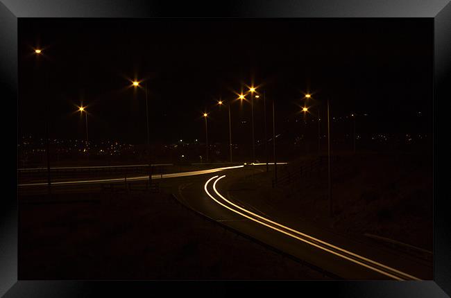 Light trails at the Junction Framed Print by Peter Elliott 