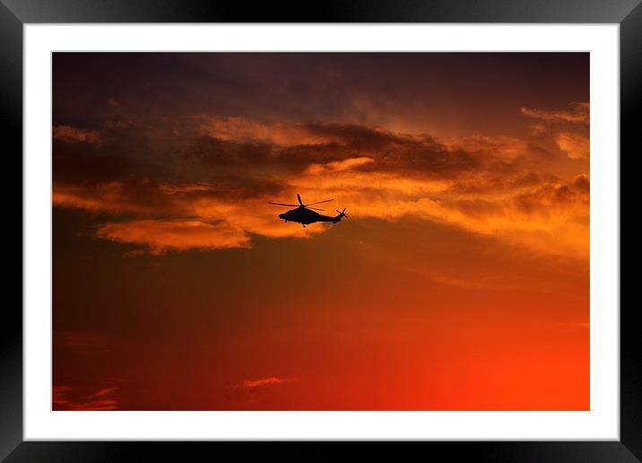 Helicopter At Sunset Framed Mounted Print by Ian Jeffrey