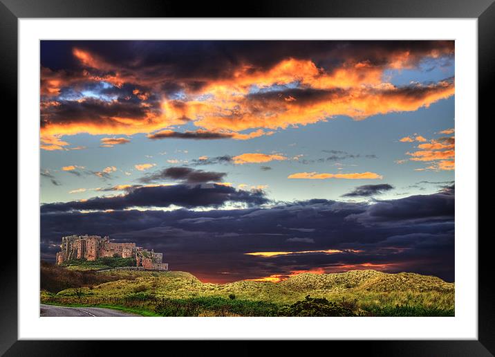 Bamburgh Castle At Sunset Framed Mounted Print by Ian Jeffrey