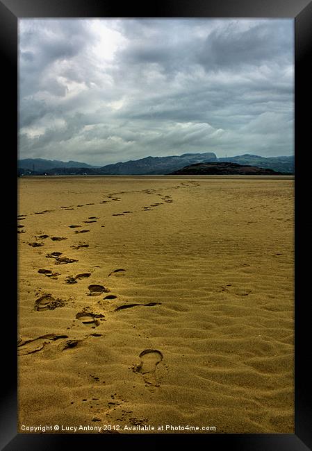 Footprints on Port Merion beach Framed Print by Lucy Antony