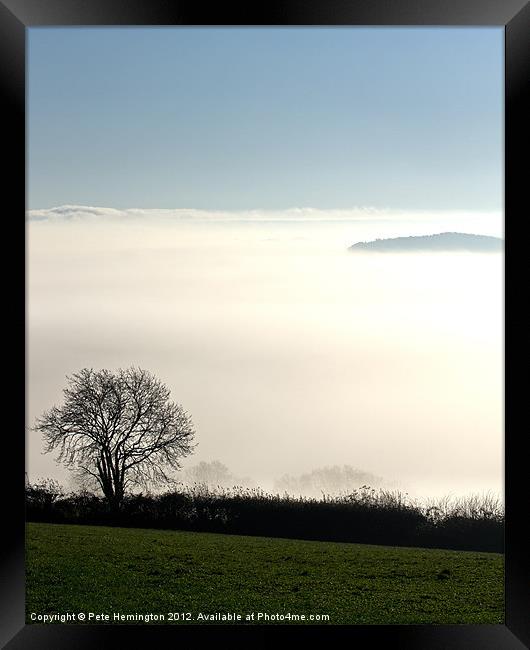 Peeping through the mist Framed Print by Pete Hemington